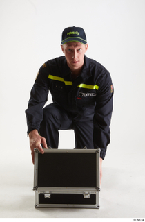 Sam Atkins Fireman Pose with Case kneeling whole body 0001.jpg